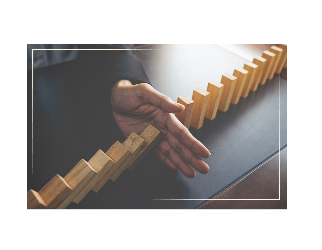 a person holding a domino board game