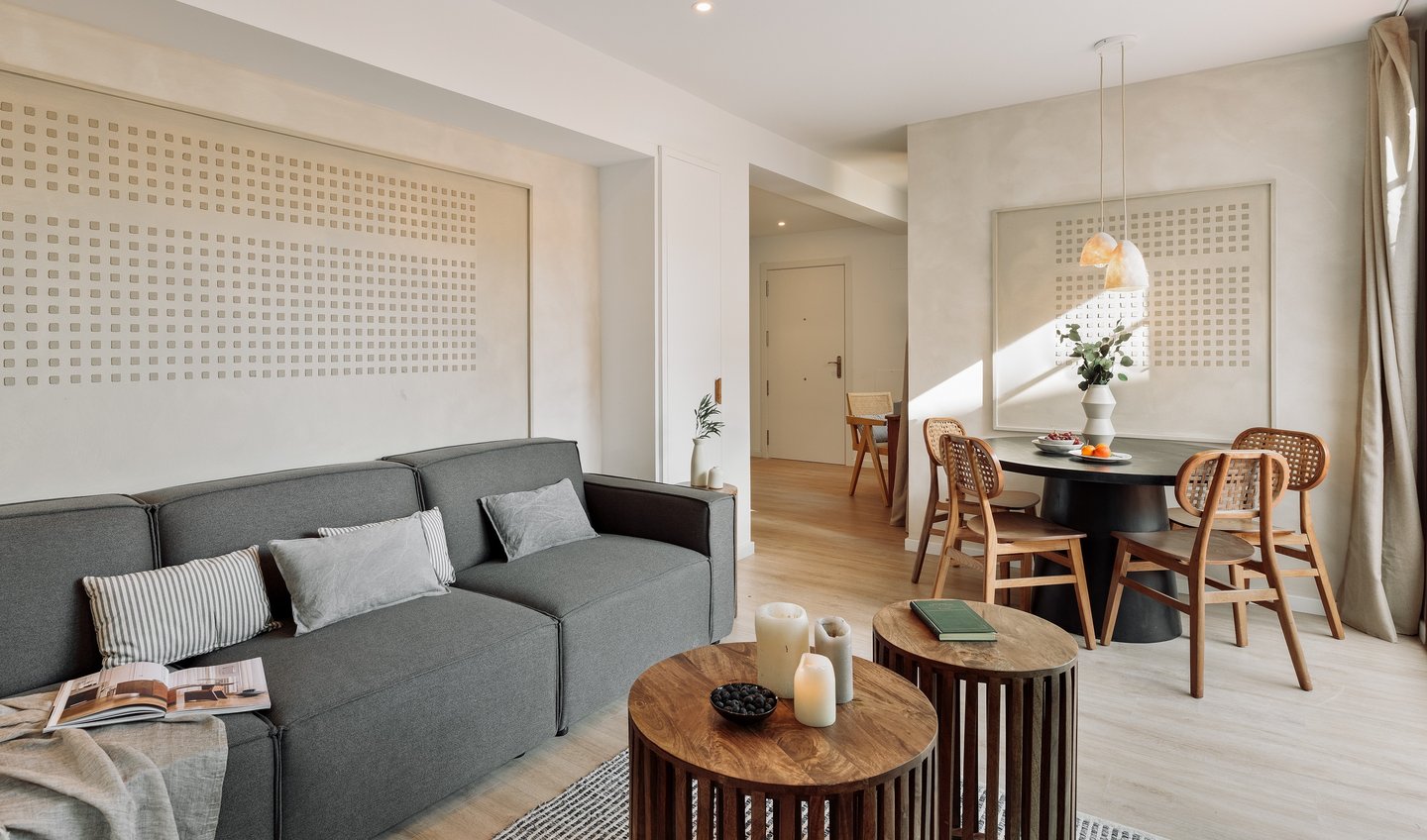 Elegant living room with contemporary design, large windows, wood elements in Barcelona