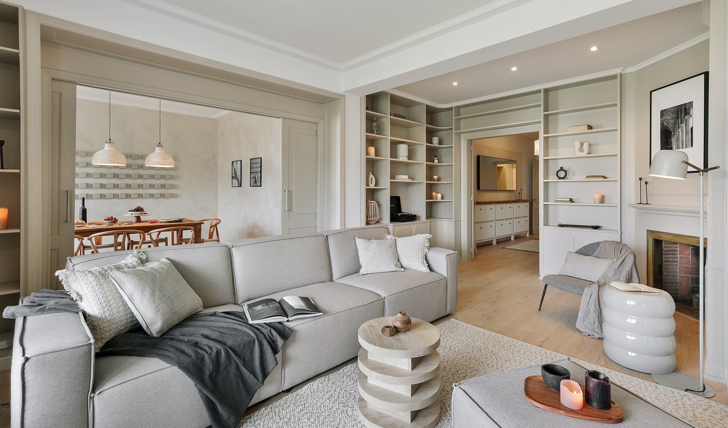 Living area with elegant decor, custom art, and calm beige tones, designed by SAVIA in Barcelona