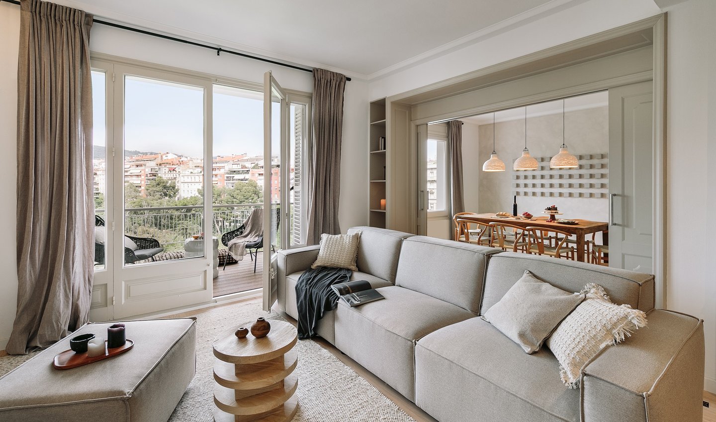 Elegant living room with bespoke wall installation, neutral tones, and subtle textures by SAVIA