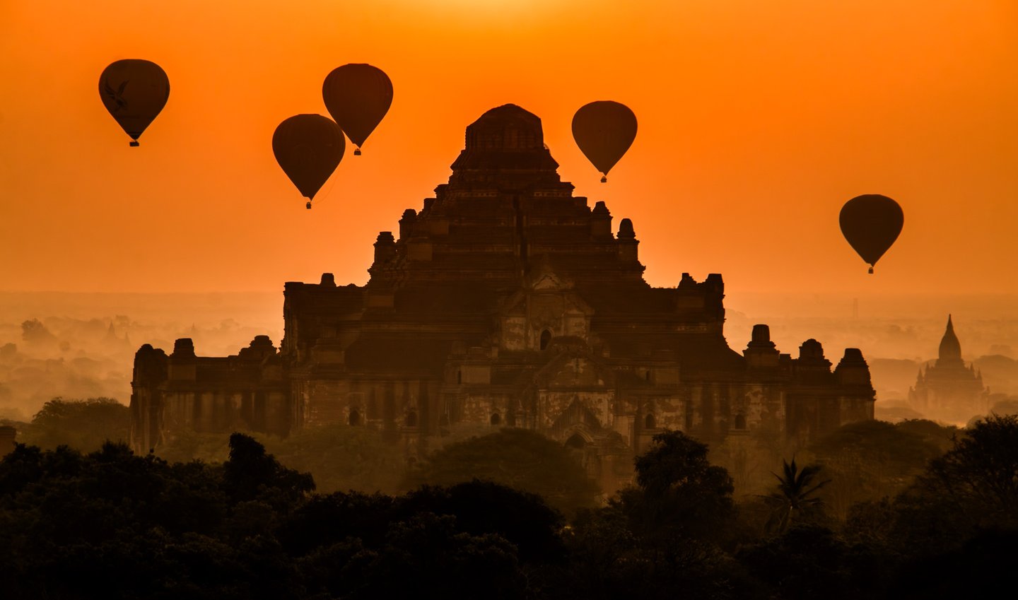 Hot air balloons tours provide a unique perspective at sunrise over the ancient temples of Bagan