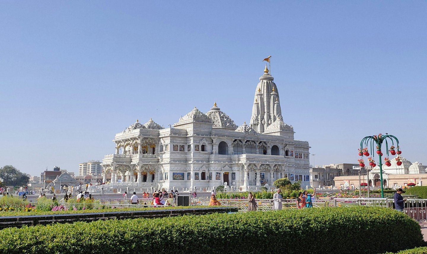 a large white building with a clock tower
