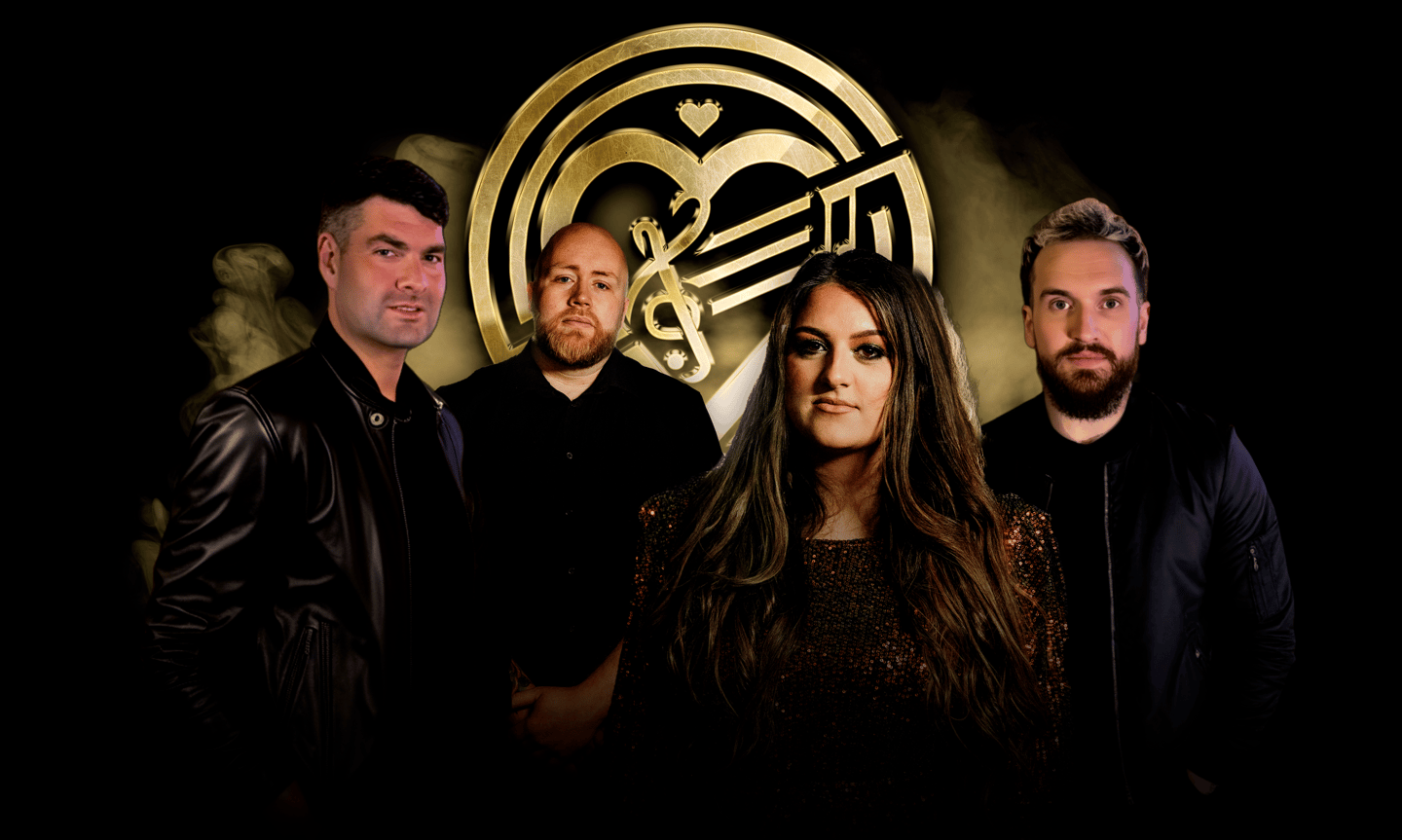a group of people standing in front of a large golden emblem