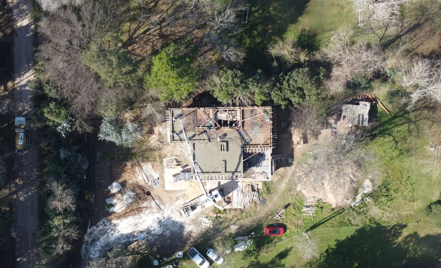 a house with a large house in the middle of a yard