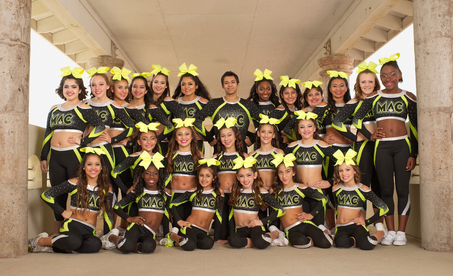 a group of cheerleaders posing for a photo