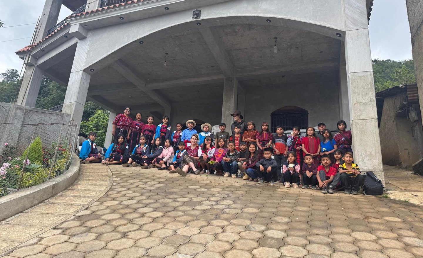 a group of people standing in front of a building