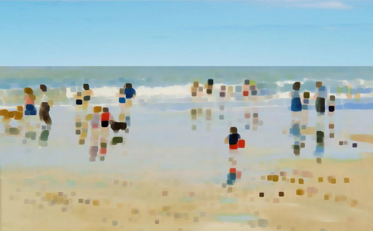 a group of people standing on a beach