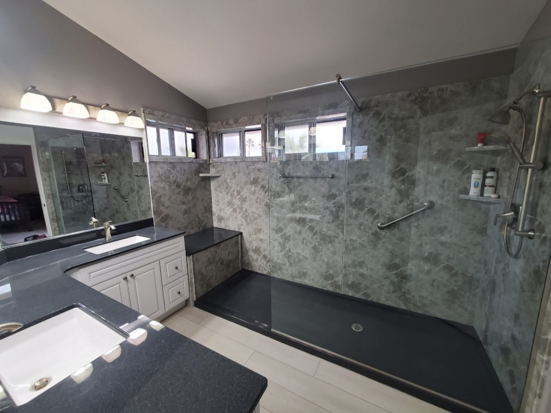 a bathroom with a shower and a shower