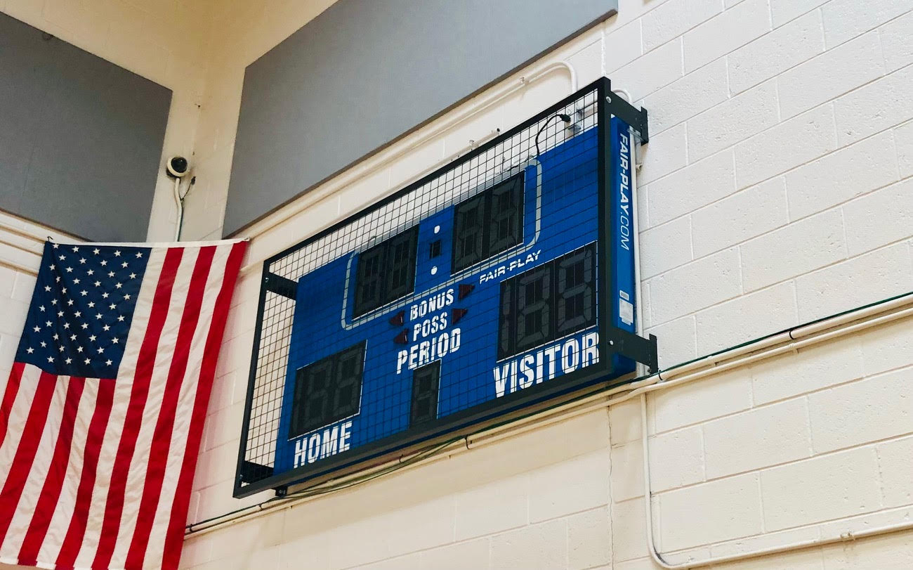 Scoreboard with wire mesh protective screen installed in Burlington NJ by Degler Whiting Inc