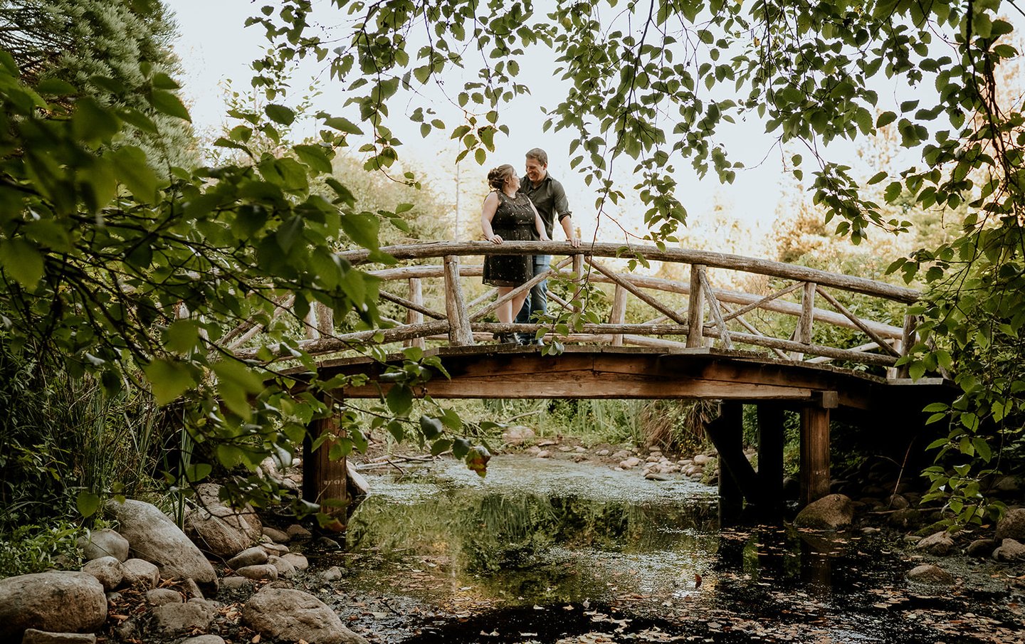 Light house park Engagement photos couple on bridge
