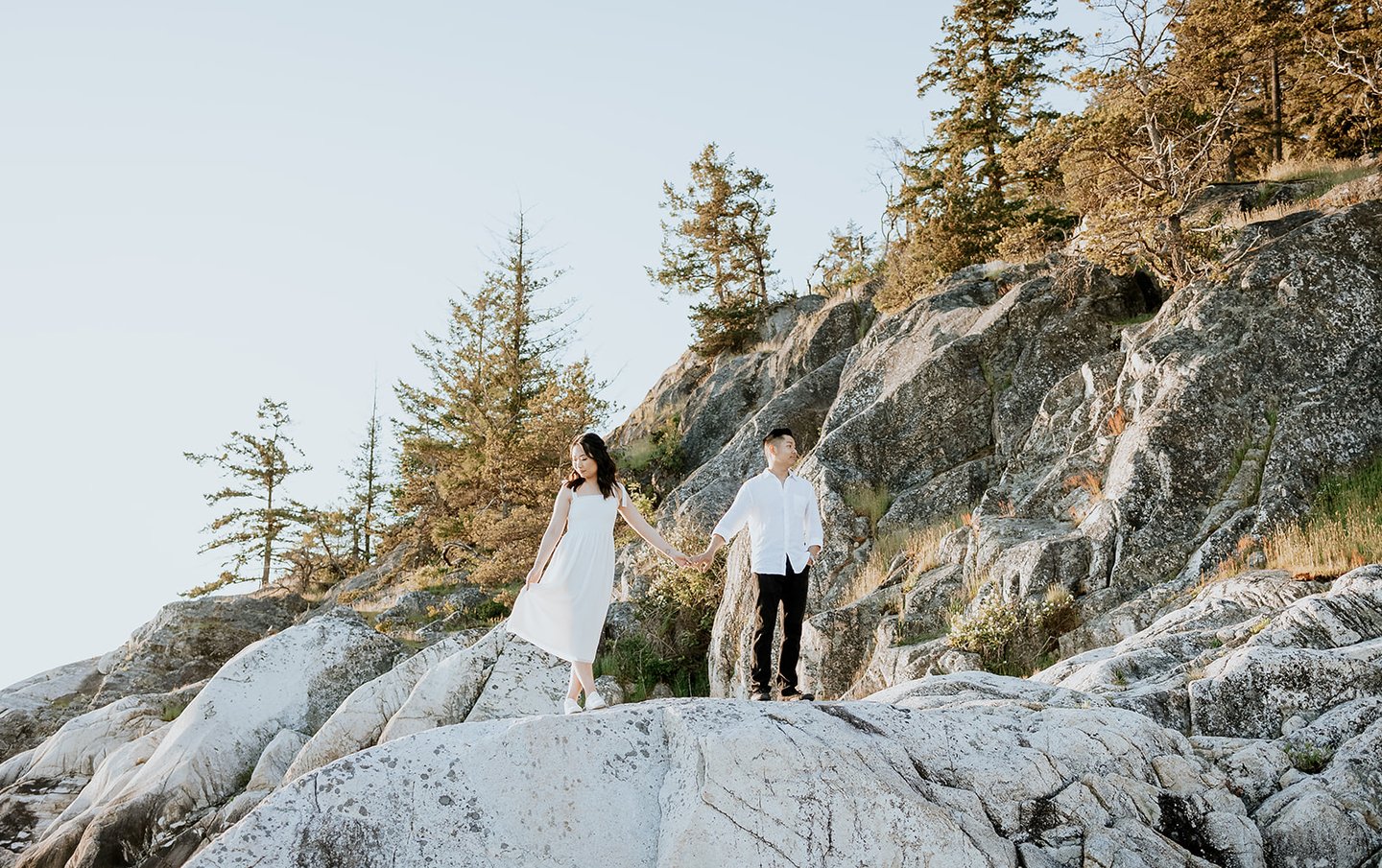 Light house park Engagement photos couple holding hands