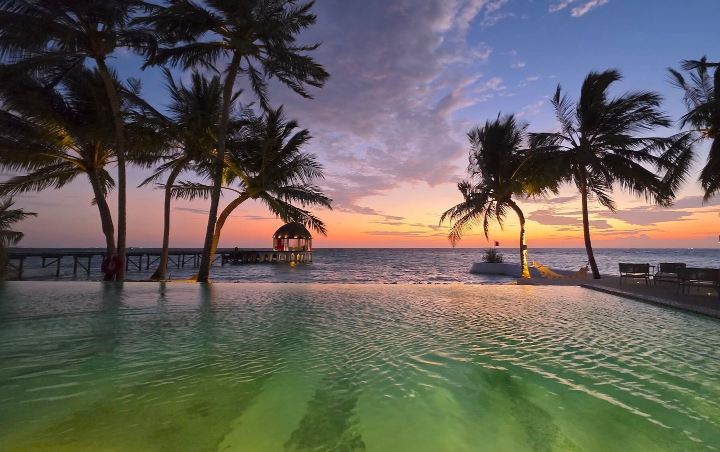 Ozen Life Maadhoo Maldives sunset pool