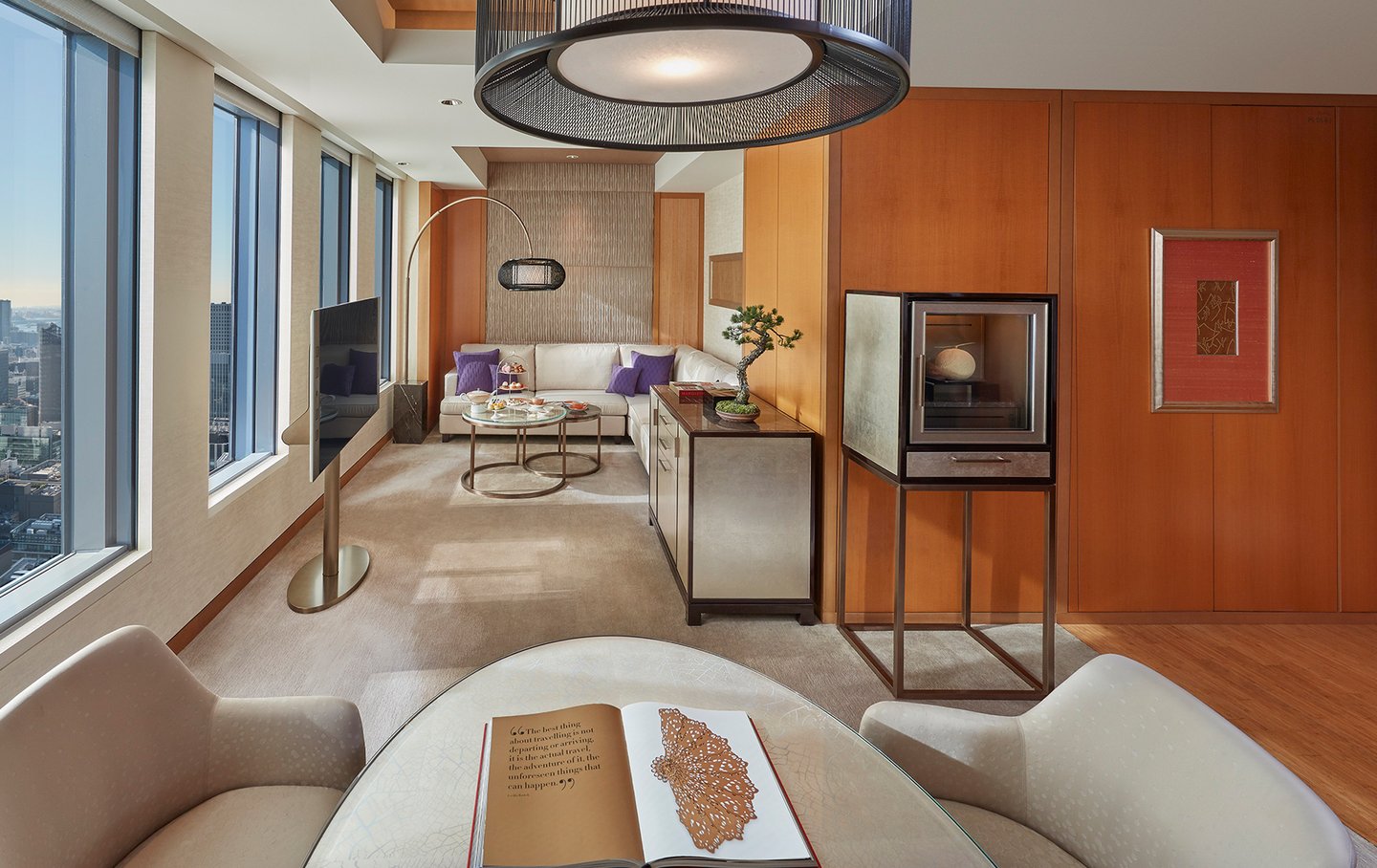 Luxury hotel room in Tokyo with floor-to-ceiling windows overlooking city