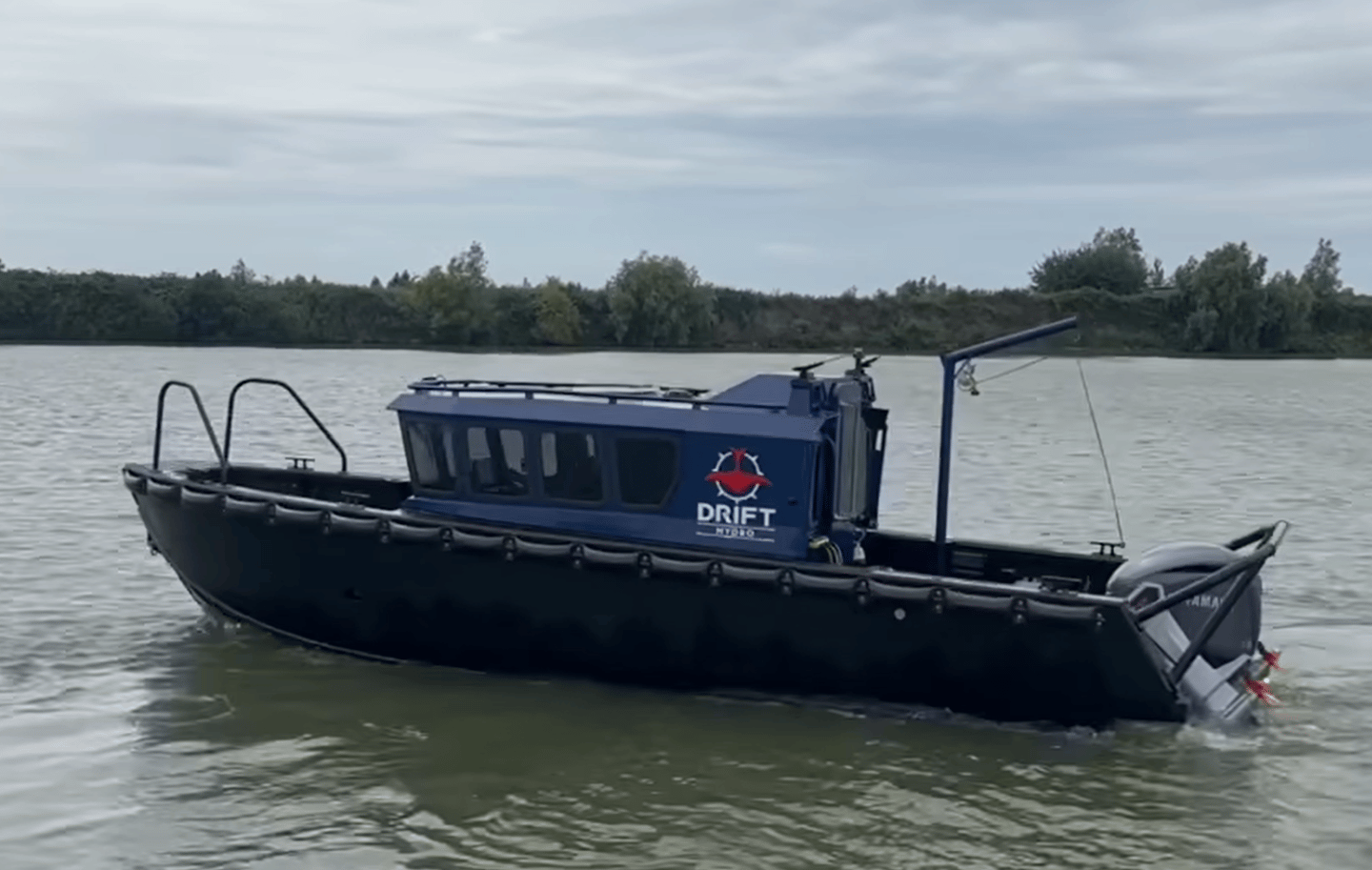 a boat with a blue and white boat in the water