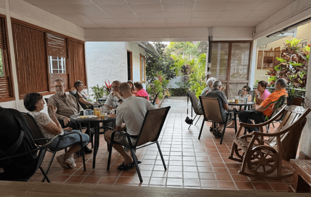 People sharing a meal and spending time together in a dining area in Santa Fe, Veraguas, Panama.