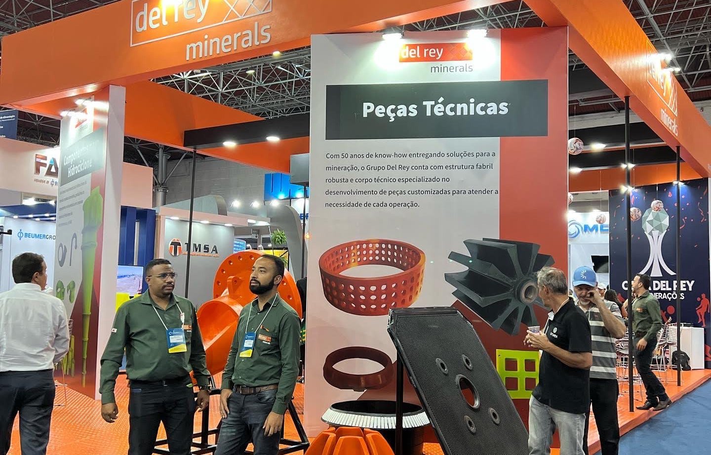 a group of people standing around a display of a variety of products