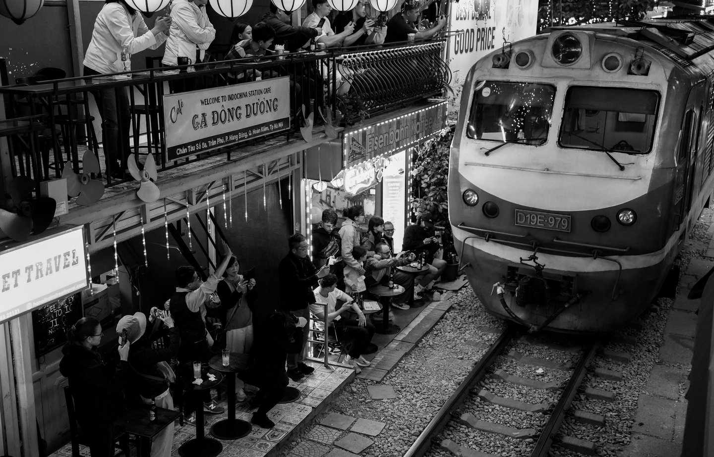 Hanoi Train Street black and white night photography train passing narrow street