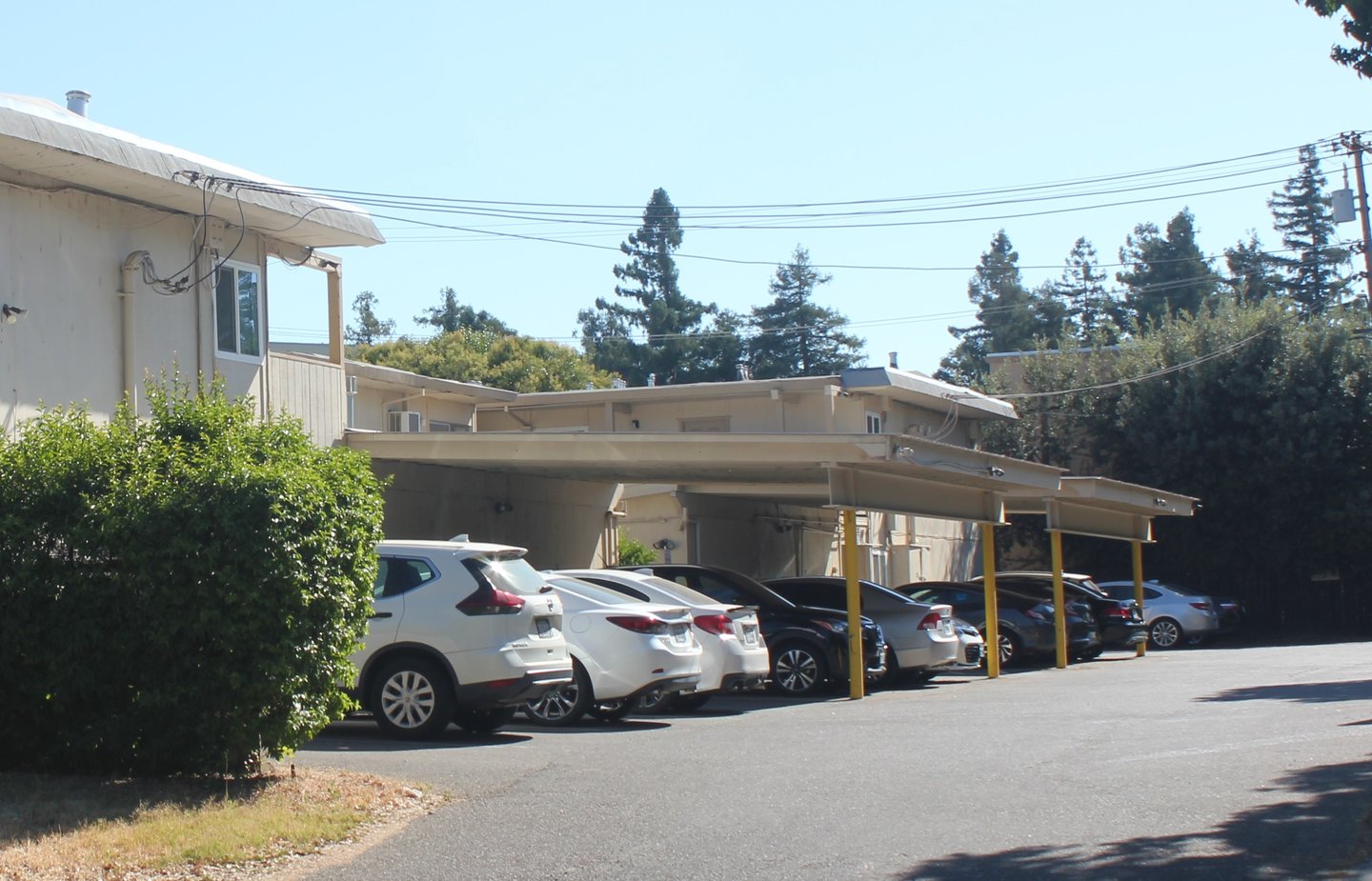 cars in off street parking lot at university commons apartments