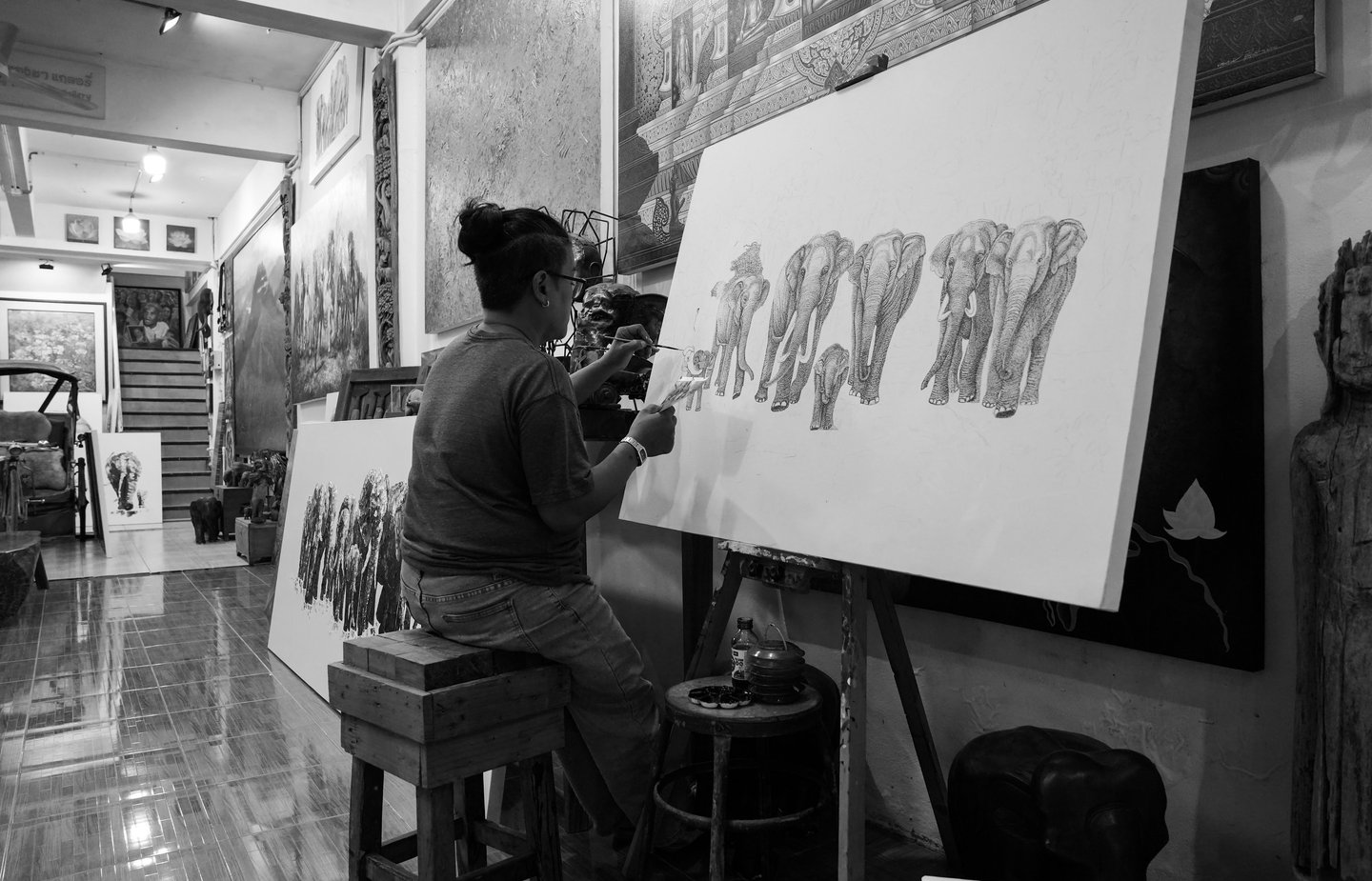 In the old town of Chiang Mai, Thailand, a street performer is at work