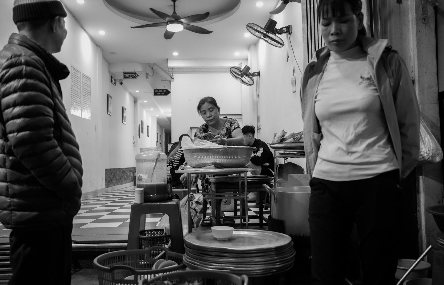 black and white night photography Hanoi light shadow street scene Vietnam