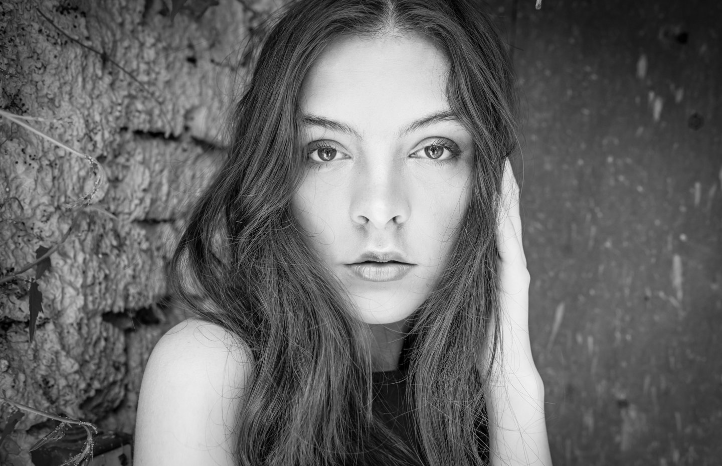 a woman with long hair and a black dress
