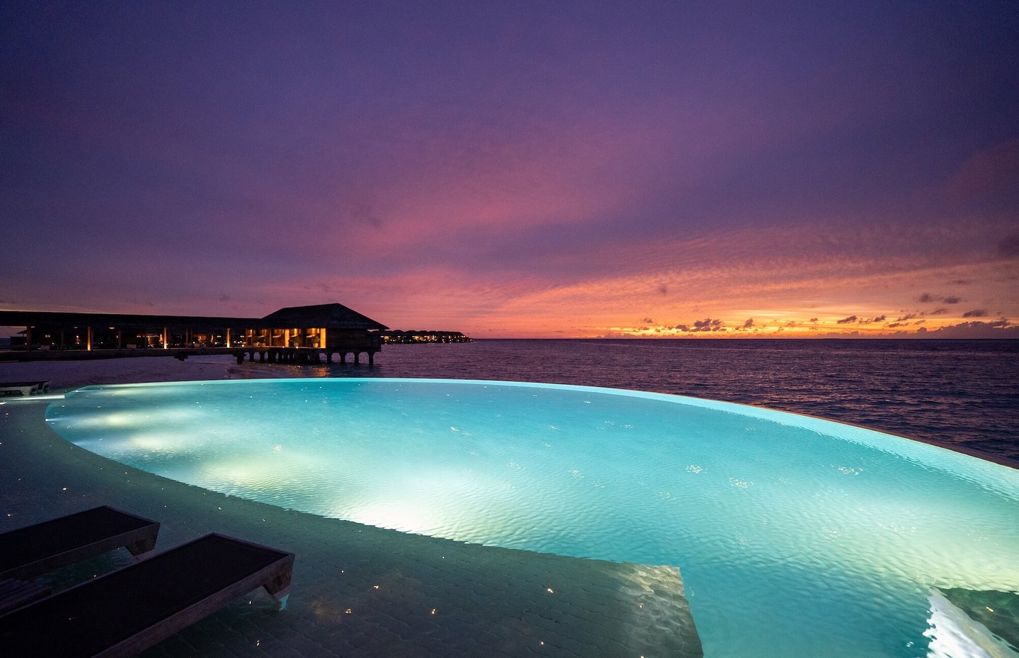 Hurawalhi Maldives main pool sunset