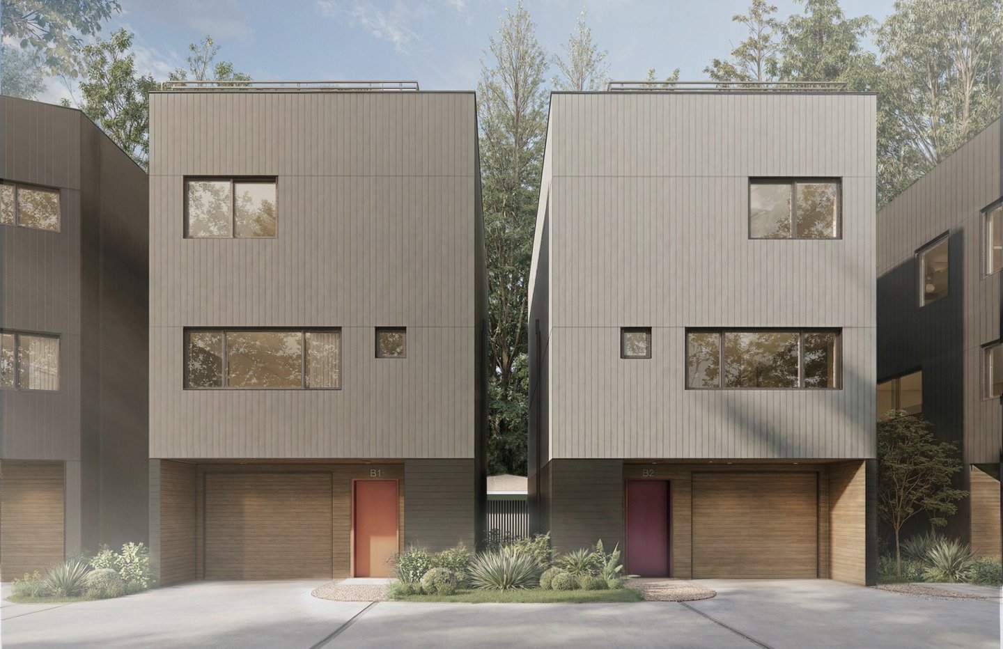 Modern gray three-story duplex townhouses with wood-paneled garages and minimalist landscaping.