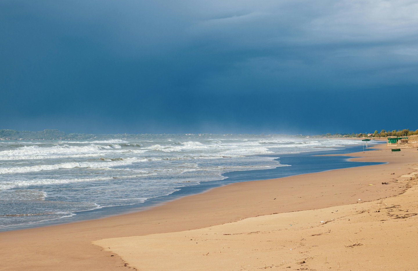 a beach with a boat in the water