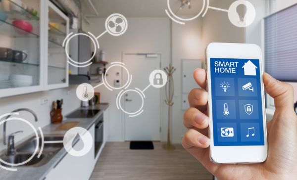 a person holding a smart phone in their hand
