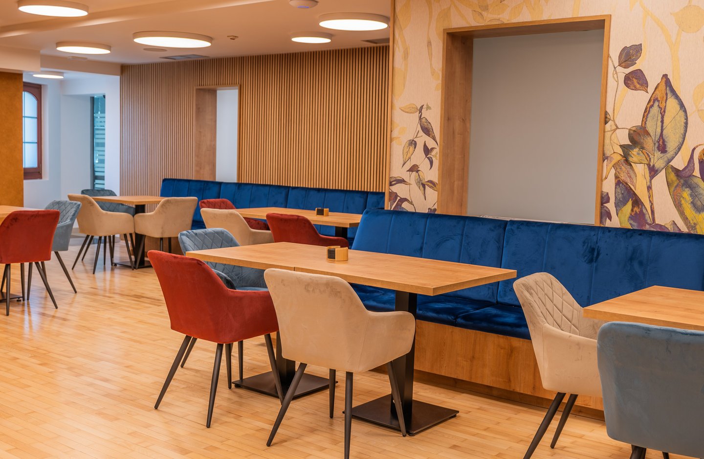 a restaurant with a long table and chairs