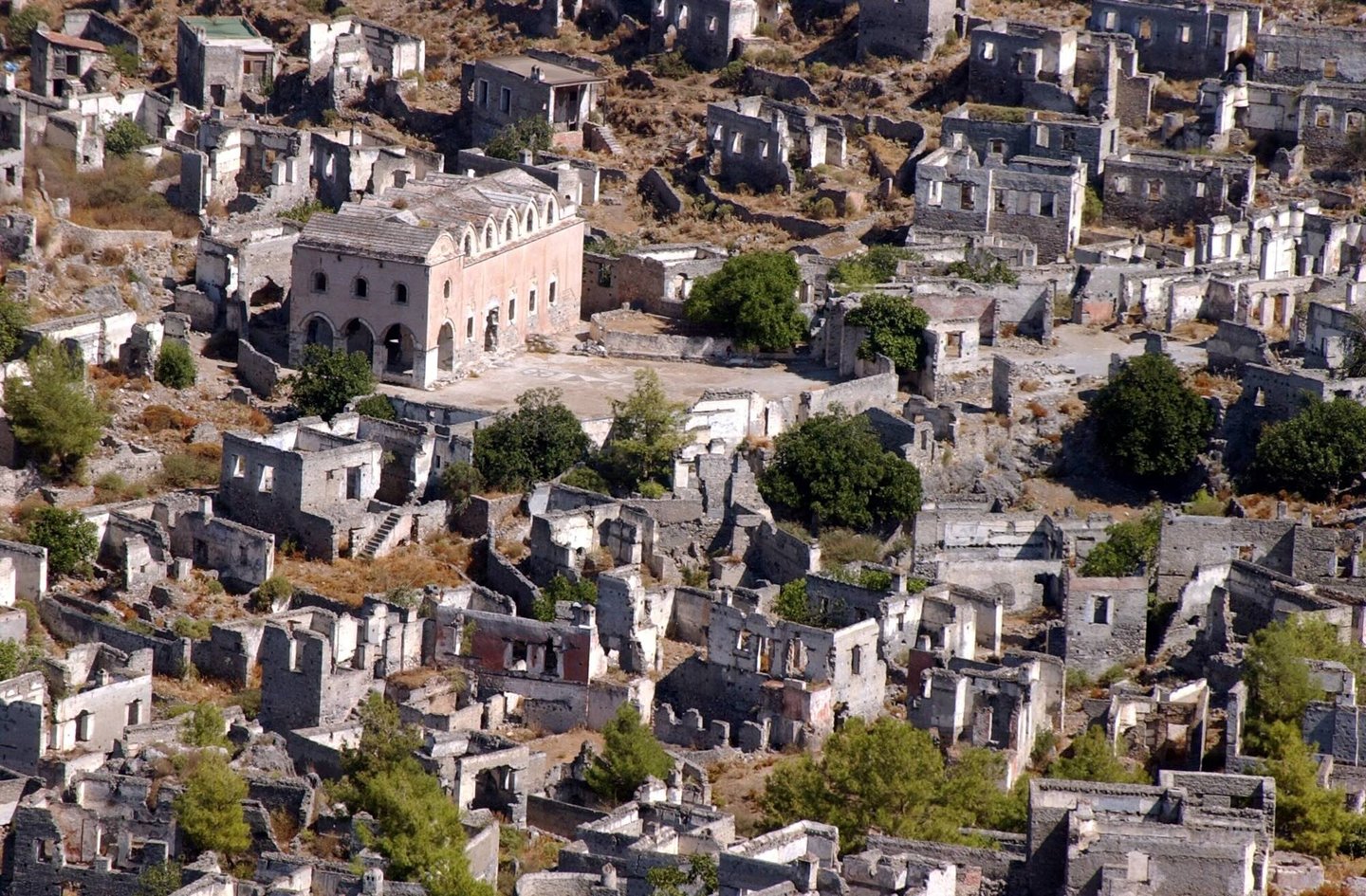 Aerial view of the abandoned stone houses and ancient church ruins in Kayakoy ghost village, Turkey.