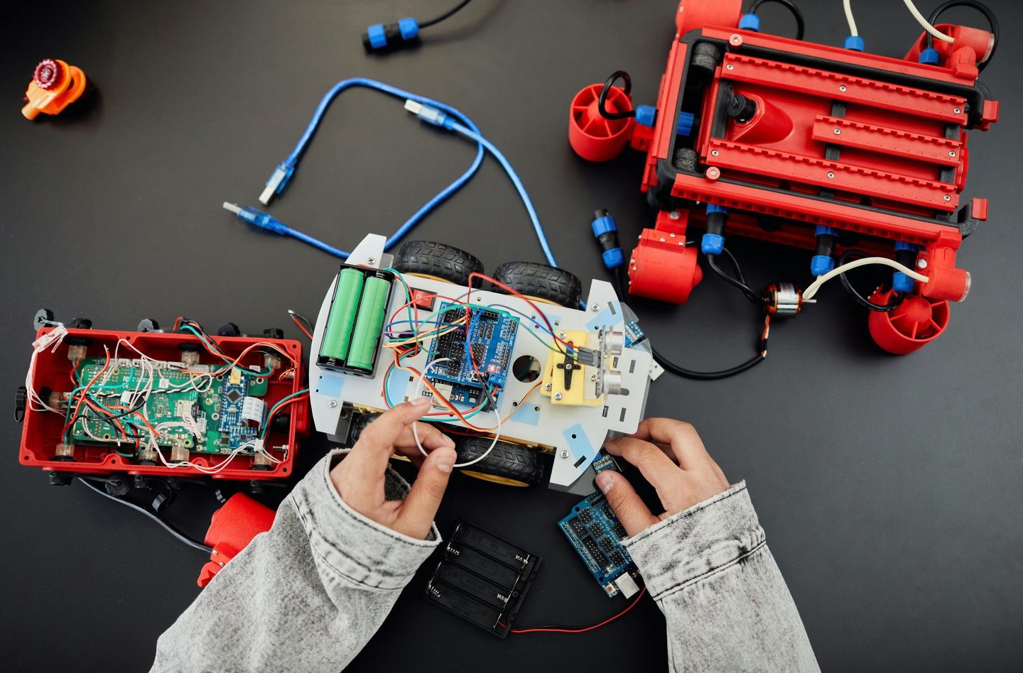 a person holding a remote control car
