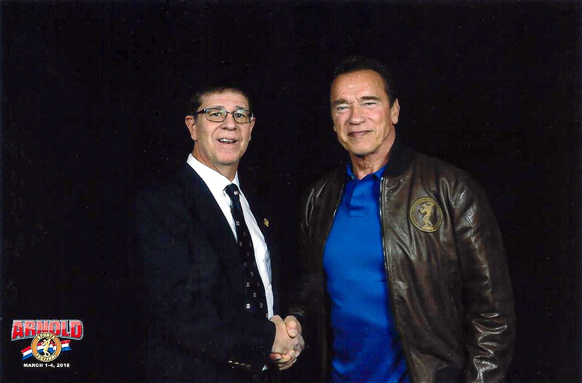 Shihan Mike Monaco shaking hands with Arnold Schwarzenegger at the 2019 Arnold Sports Festival.