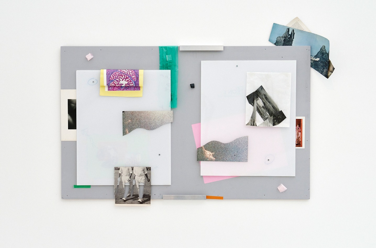 Karl Russell Vickers a notice board with fragments of pictures, paper cutouts and leftover tape