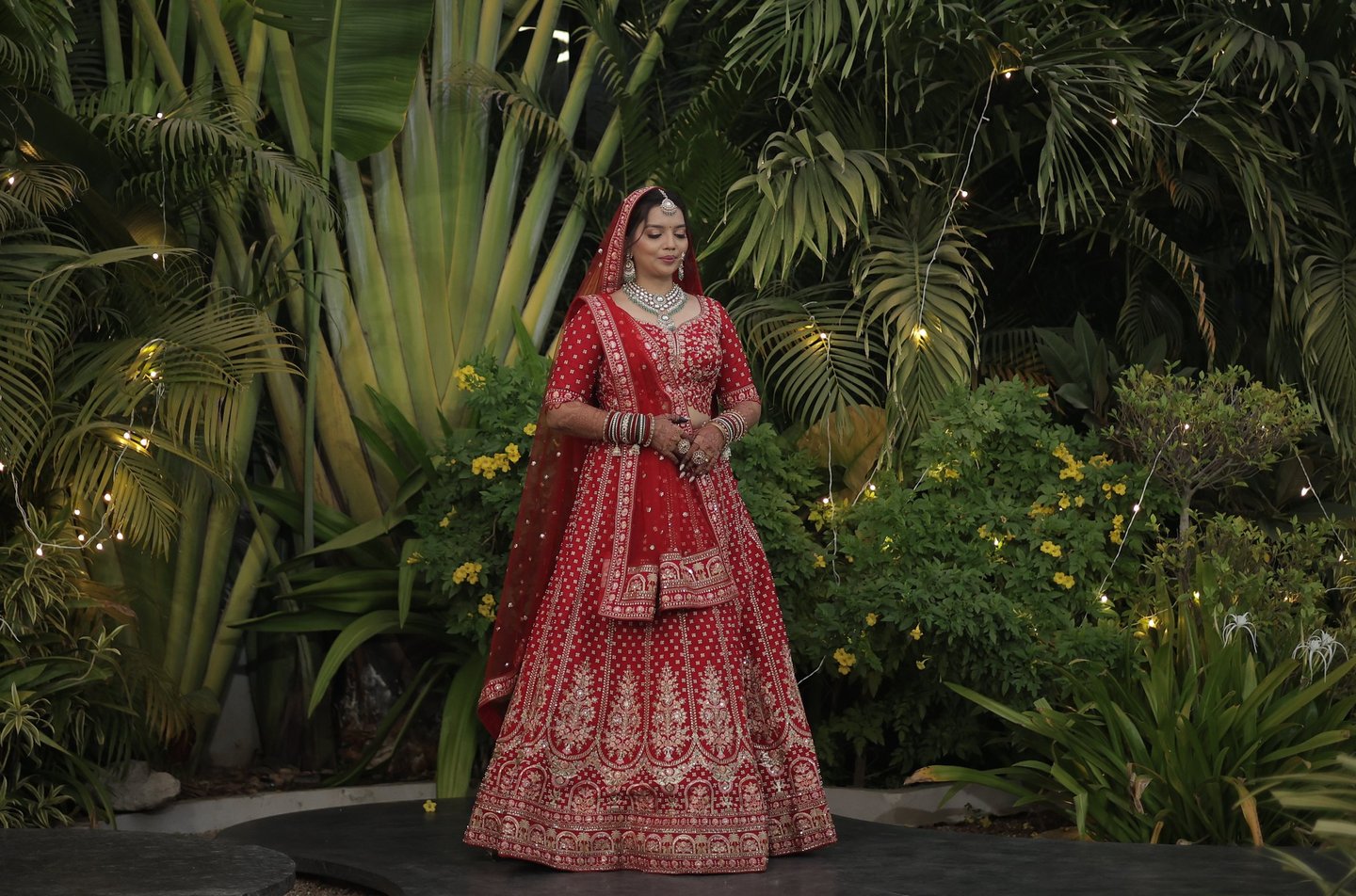 Gujarati bride red lehenga bridal makeup Vadodara, destination wedding and party plot reception brid