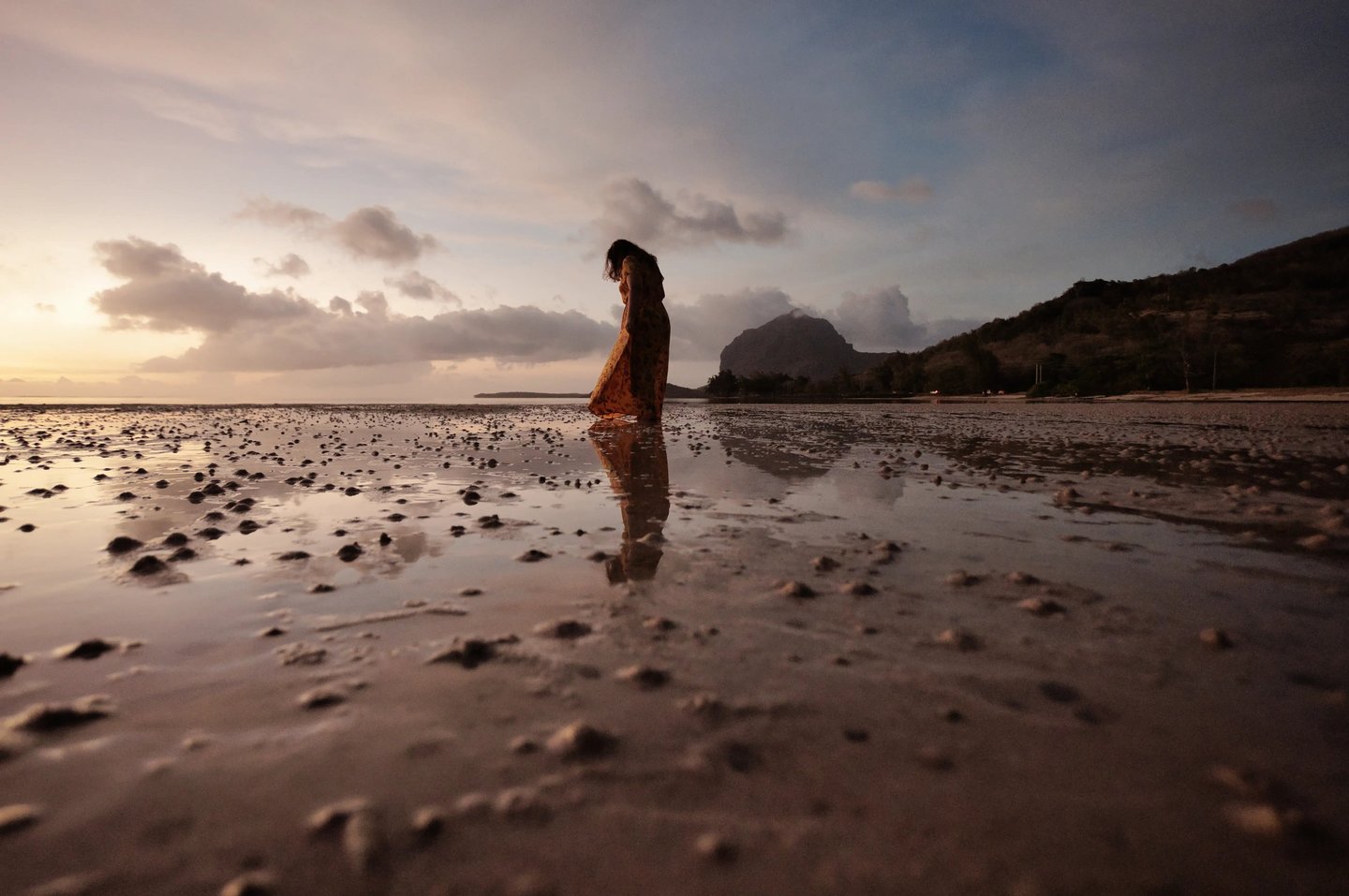 Silhouette of a woman on the beach with Le Morne Brabant in the background, Mauritius