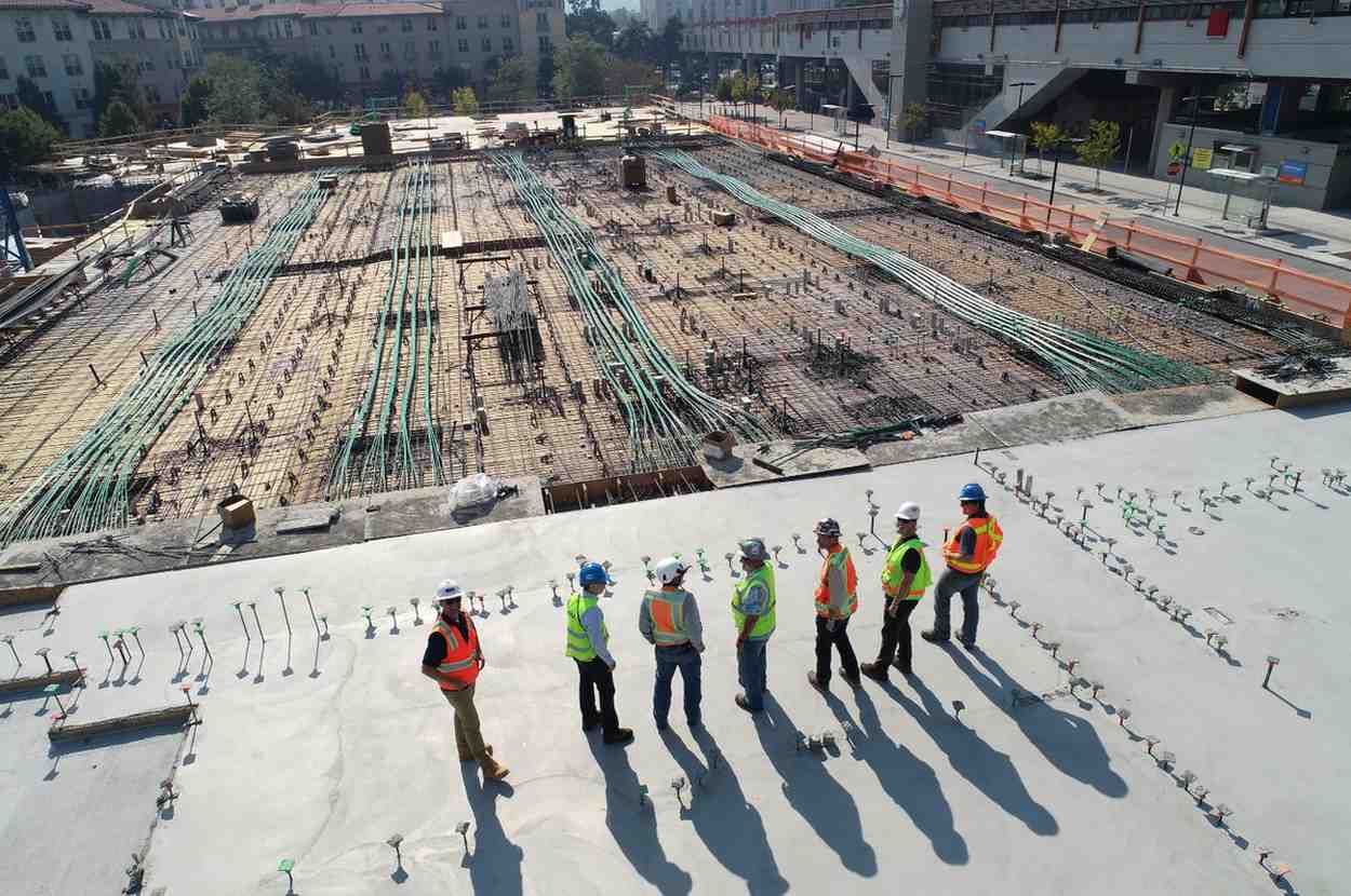 General contractor reviewing construction plans at an active commercial build site in Columbus Ohio