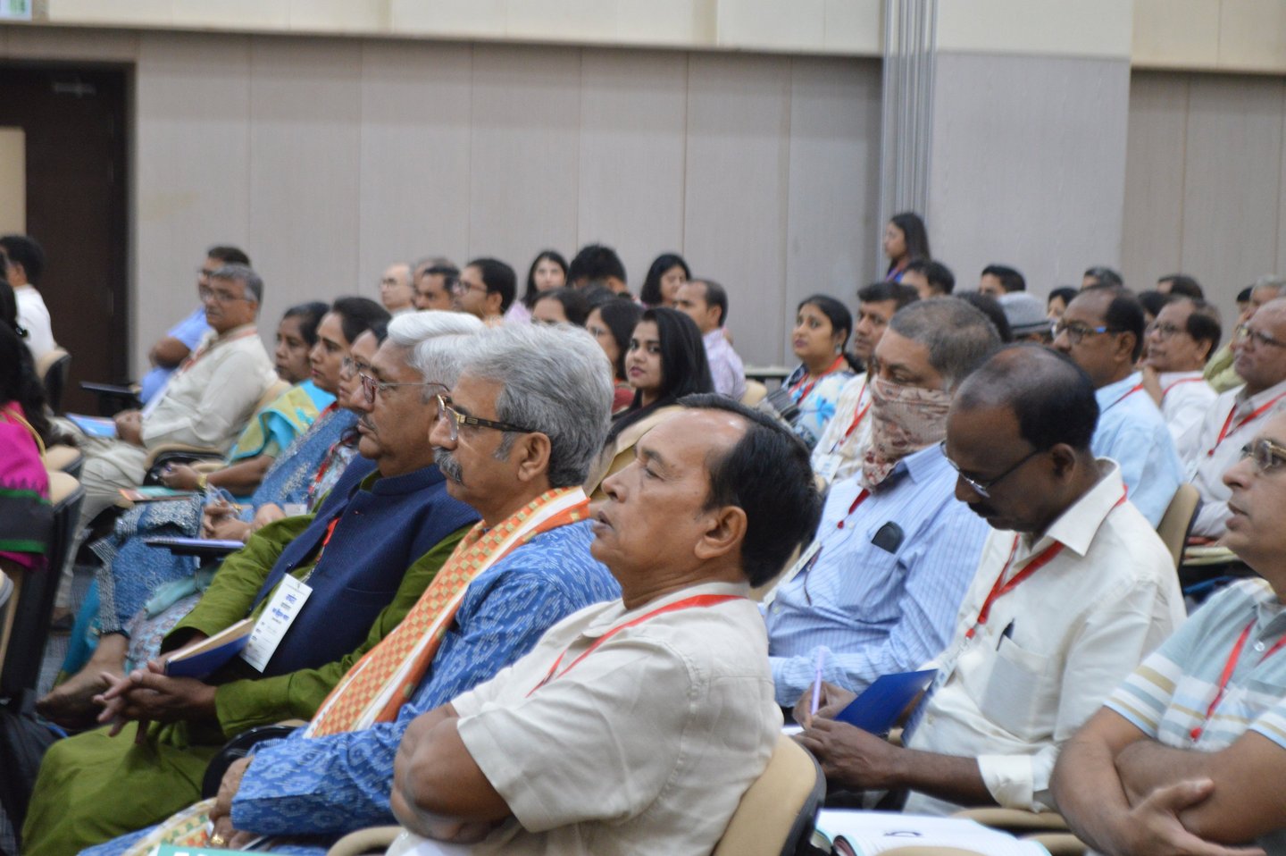 a group of people sitting in chairs in a room