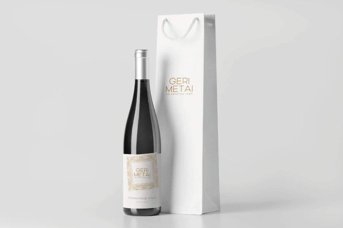 clear rowan wine label on a dark bottle and a gift bag with a logo