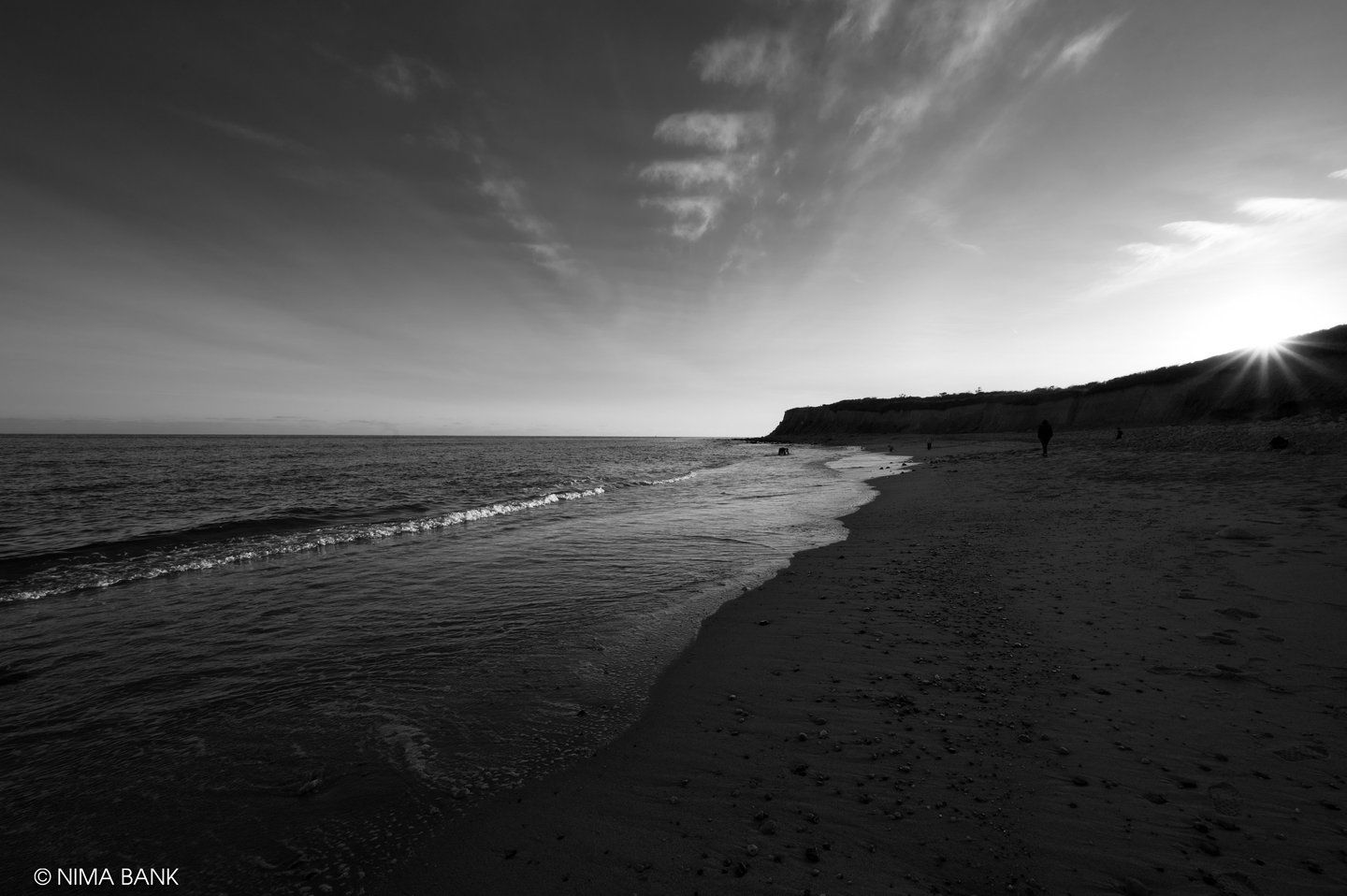 a black and white photo of a beach