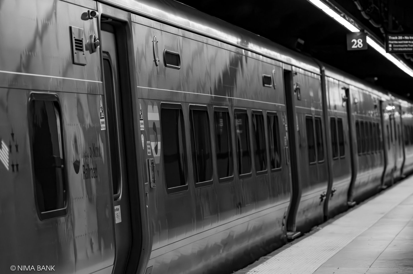 metro north train cars in grand central terminal in midtown nyc, black and white