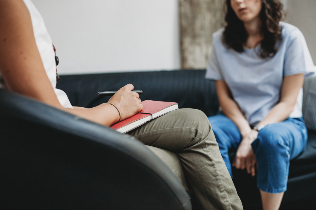 Therapist taking notes in therapy session for anxiety and depression in Oregon with Paula Fontenelle