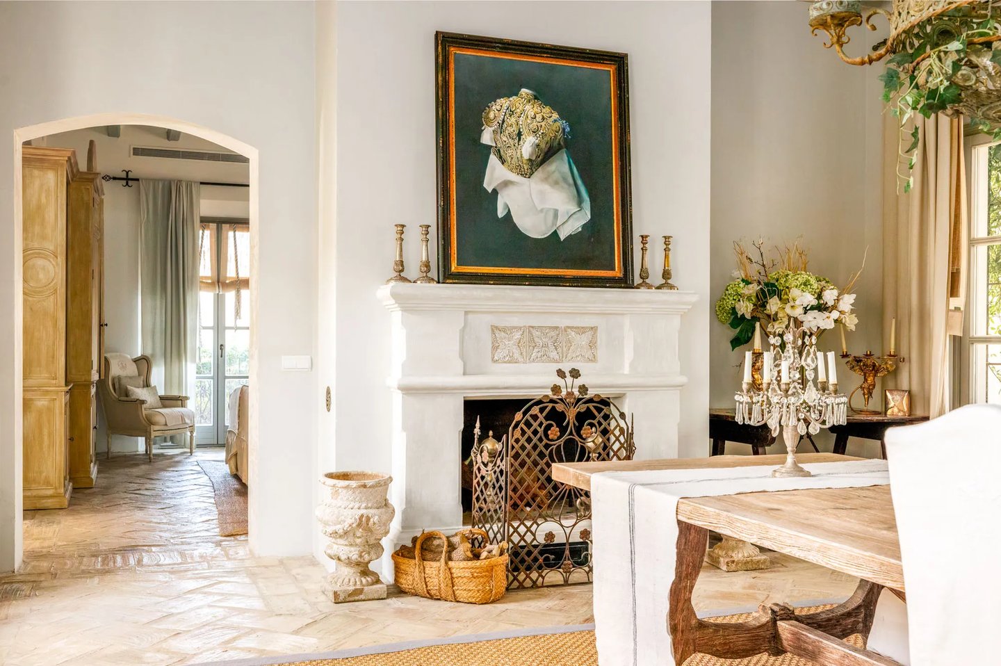 Fireplace with artwork and rustic decor at Finca Santa Katerina