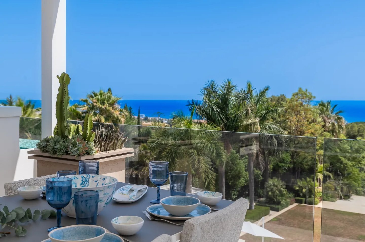 Rooftop dining terrace with ocean backdrop at Villa Serenity