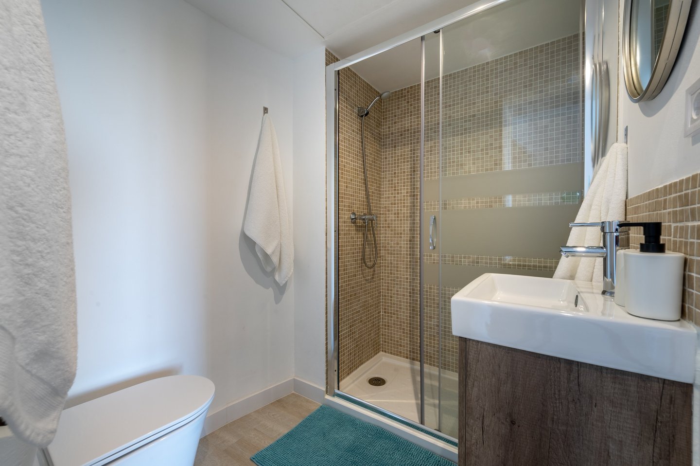 a bathroom with a shower and a toilet