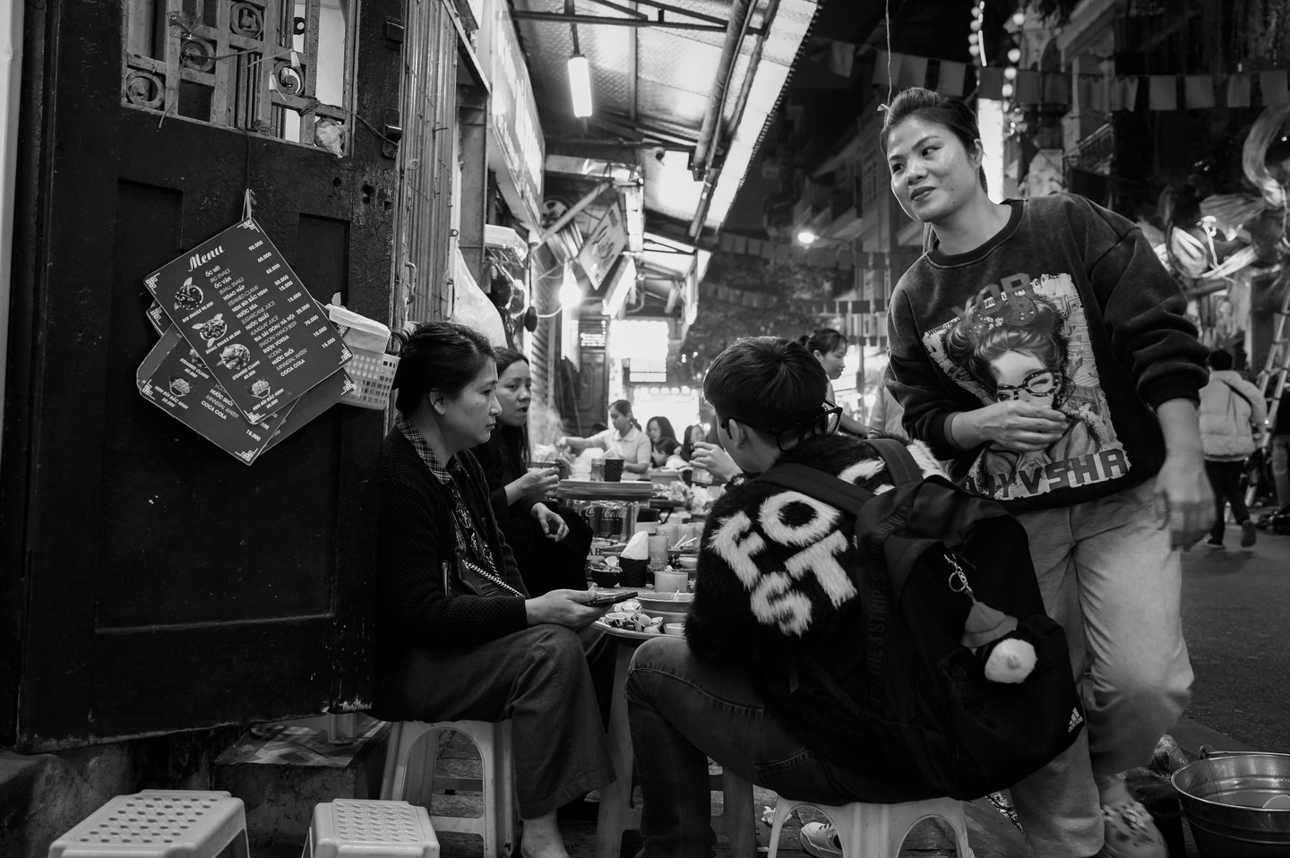 Night life in the Old Quarter of Hanoi – small plastic stools, street food, and everyday moments unf