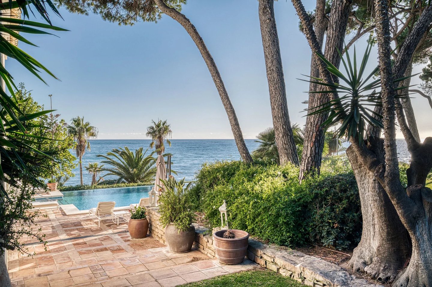 Pool terrace with sun loungers overlooking the Mediterranean