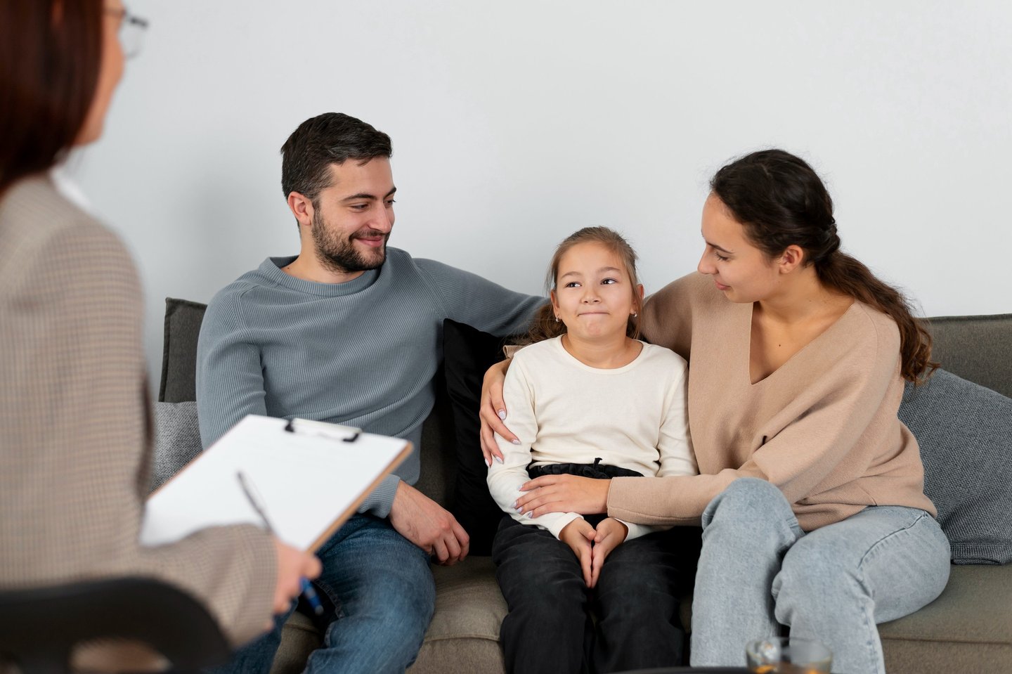 Parents in family therapy with their child
