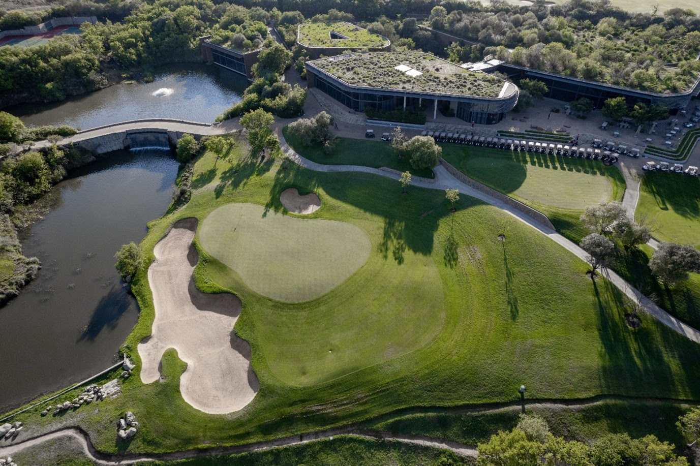 An aerial view of the 9th green and clubhouse at The Club at Steyn City, host venue of LIV Golf Sout