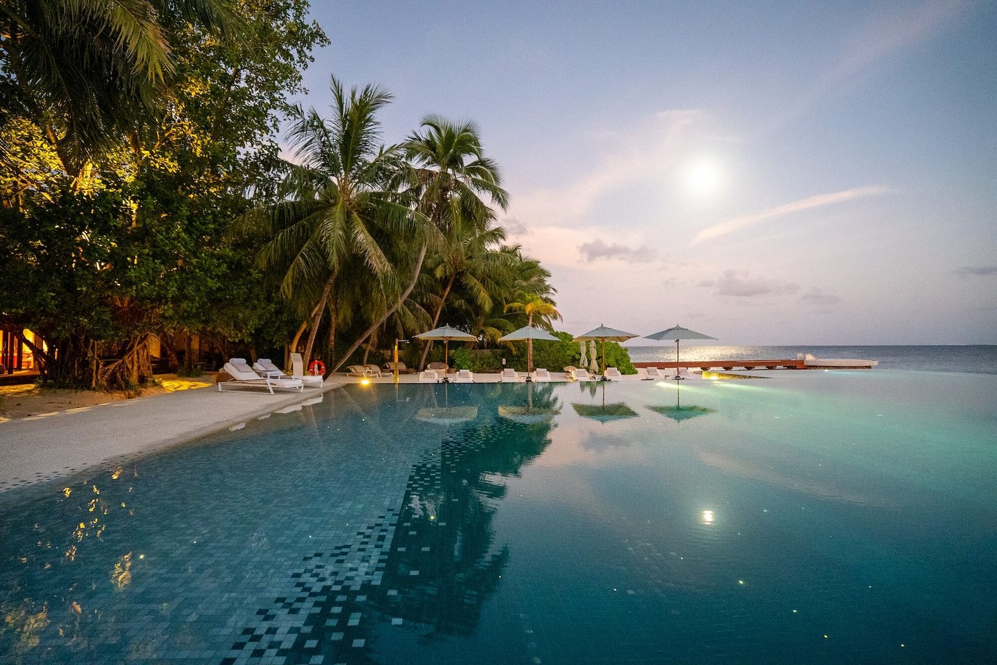 Huvefen Fushi Maldives pool sunset